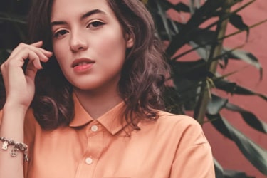 Woman wears orange shirt